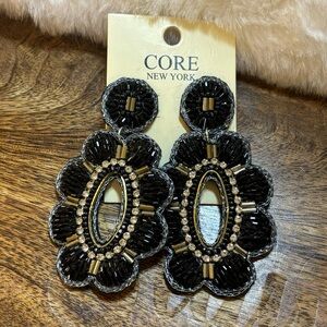 SWEET AS BLOOMS BEADED OPEN OVAL DROP WITH A SCALLOPED EDGE IN BLACK